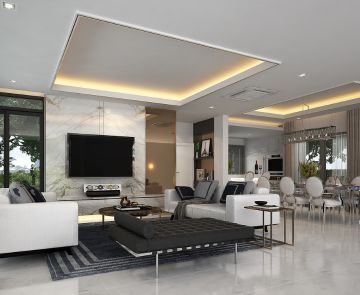 A luxurious modern kitchen featuring white cabinets and elegant gray flooring, designed by a top interior designer in Kolkata.