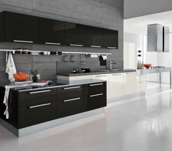A modern kitchen with black and white cabinets, featuring sleek design and contrasting colors.