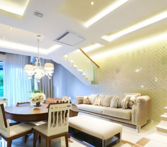 A turnkey living room with a sleek dining table and chairs